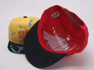 Detail of kids hip hop cap showing inner brand label and adjustable plastic strap