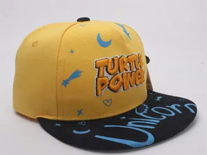 Detail of Turtle Power towel embroidery on yellow and black hip-hop baseball cap