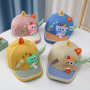 Detail showing four color combinations of kids baseball caps with 3D dinosaur horns