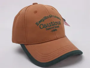 Detail of vintage baseball cap with embroidered Keep Enthusiasm and forever blood text