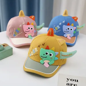 Cute cartoon dinosaur toddler baseball caps in pink, blue, and yellow with 3D accents