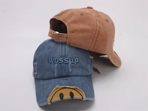 Detail of vintage washed cotton baseball caps with distressed edges and metal buckle