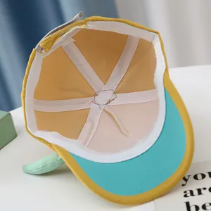 Close-up of baby baseball cap interior showing breathable mesh and fine stitching details