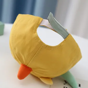 Detail view of cotton baseball cap showing the adjustable velcro strap and cute 3D design