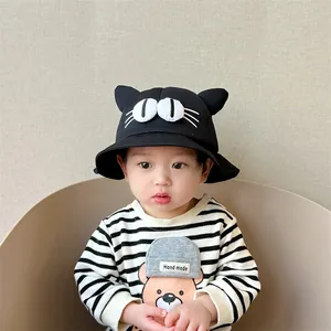 Detail of cute black cat baby bucket hat with 3D ears and cartoon eyes embroidery