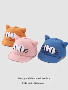 Three colorful cotton baby baseball caps with 3D cat eyes and ears detail in a group