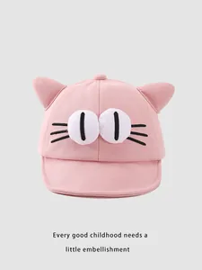 Detail of pink cotton baby baseball cap with cute cat ears and cartoon eye embroidery