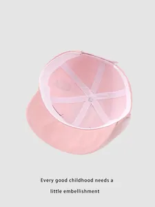 Detailed interior of pink cotton toddler baseball cap with 6-panel stitching and soft lining