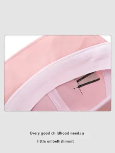 Detail view of pink baby hat interior with high-quality stitching and soft sweatband