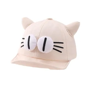 Cute cartoon baby baseball cap with 3D cat ears and large eyes in soft beige cotton