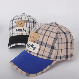 Kids plaid baseball cap featuring a 3D plush bear head and Lucky label design