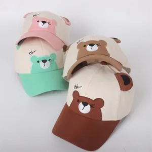 Cute kids cartoon bear baseball caps in pink, mint, and brown with 3D ears design