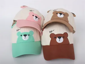 Detail of four colorful kids baseball caps featuring cute 3D bear ears and embroidery