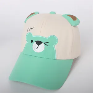 Detail of kids baseball cap featuring mint green 3D bear ears and cartoon embroidery