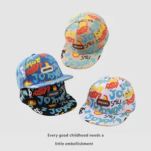 Kids flat-brim hip hop baseball caps with colorful graffiti prints and leather groove patch