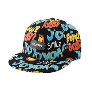 Kids black snapback baseball cap with colorful graffiti print and rubber Groove badge