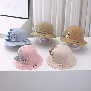 Detail of baby dinosaur bucket hats in five pastel colors with cute 3D spiky design