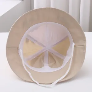 Detail view of cotton sun hat interior with soft lining and adjustable windproof strap