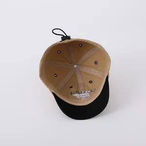 Detail showing internal six-panel structure and adjustable drawstring of a baby baseball cap