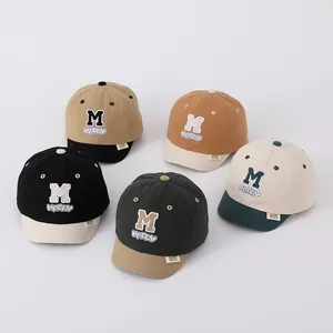 Five styles of baby cotton baseball hats with M and HAPPY embroidery in various color blocks