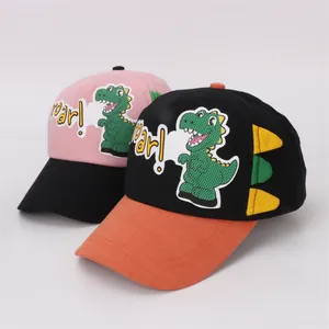 Kids baseball caps with cartoon dinosaur patch and colorful roar design elements