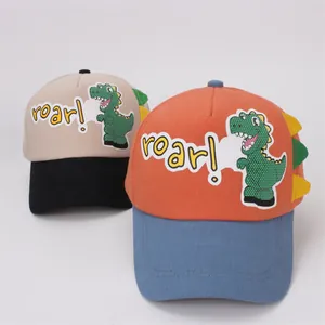 Detail of cartoon dinosaur patch and roar embroidery on breathable kids baseball cap