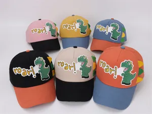 Detail of colorful kids dinosaur baseball caps with 3D spine and roar embroidery