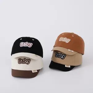 Detailed view of baby baseball caps with bold 3D embroidery and durable fabric textures