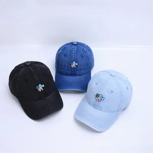 Three denim baby baseball caps with cat embroidery in black, dark and light blue colors