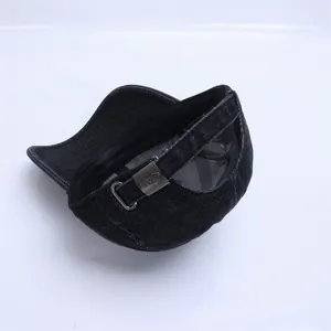Detailed view of the adjustable metal buckle on this blue denim baby baseball cap
