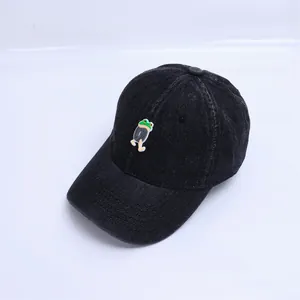 Close-up of black denim baby baseball cap featuring a cute cartoon frog patch embroidery