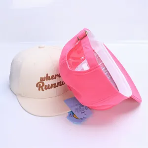 Detail of kids baseball cap showing inside structure and embroidered RUN letter logo