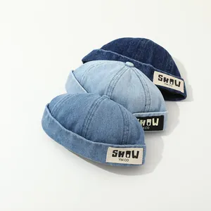 Three shades of denim docker caps for kids with vintage stitched patch detail