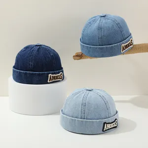 Three shades of denim docker hats with ANGELS embroidery on a stylish display