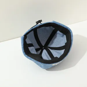 Detail view of denim miki hat showing inner reinforcement and adjustable buckle