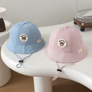 Breathable cotton HAPPY Bear baby sun hats in blue and pink with adjustable chin strap