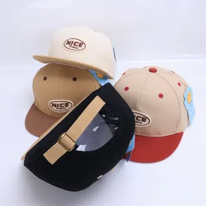 Detail view of colorful kids hip hop hats featuring NICE embroidery and adjustable back straps