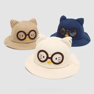 Detailed close-up of cotton sun hats for girls featuring cat ears and glasses embroidery