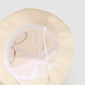 Detail view of toddler sun hat with breathable mesh lining and adjustable windproof strap