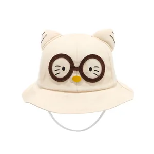 Beige kids sun hat with cartoon cat embroidery and 3D ears on a white background