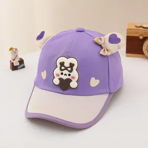Detail of baby baseball cap featuring 3D rabbit ears and heart pattern embroidery
