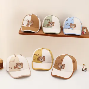 Detail view of colorful kids baseball caps featuring 3D silicone bear patches and letters