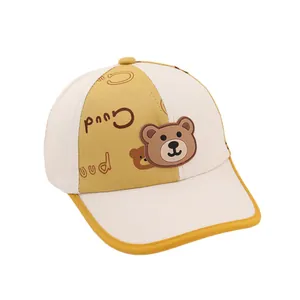 Kids baseball cap in beige and mustard yellow with a cute cartoon bear and Good text