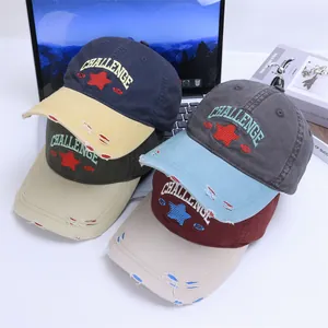 Detailed view of distressed baseball caps with embroidered stars and vintage lettering