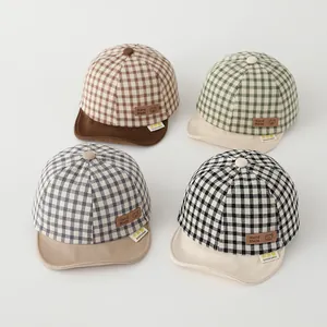 Detailed grid showing checkered baby baseball caps in brown, green, gray and black colors