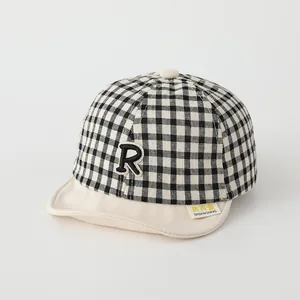 Infant checkered baseball cap with R patch and soft brim for spring outdoor wear