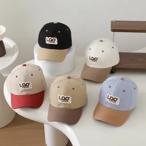 Collection of retro two-tone cotton baseball caps with embroidered LDO SURPRISE patches