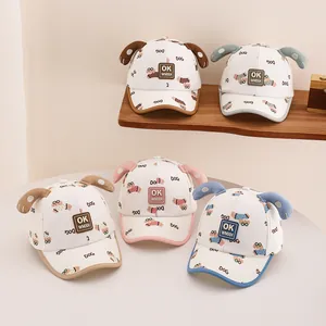 Detail view of five toddler dog-ear baseball caps showing 3D ears and cartoon prints