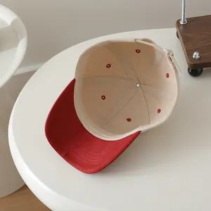 Detail view of the interior construction and reinforced stitching of a baseball cap