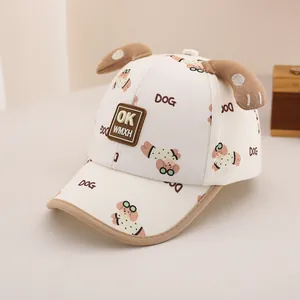 Detail of toddler baseball cap featuring 3D ears and cartoon dog pattern with logo